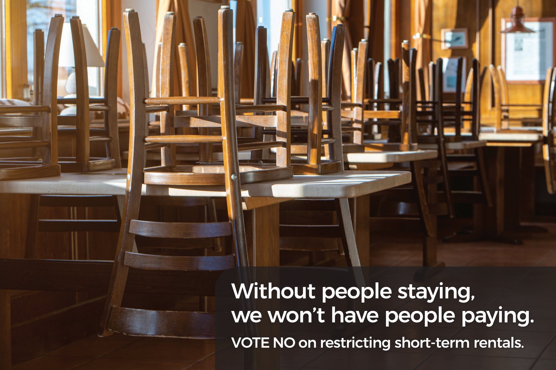 Mailer front: chairs stacked on tables in a closed restaurant dining room.